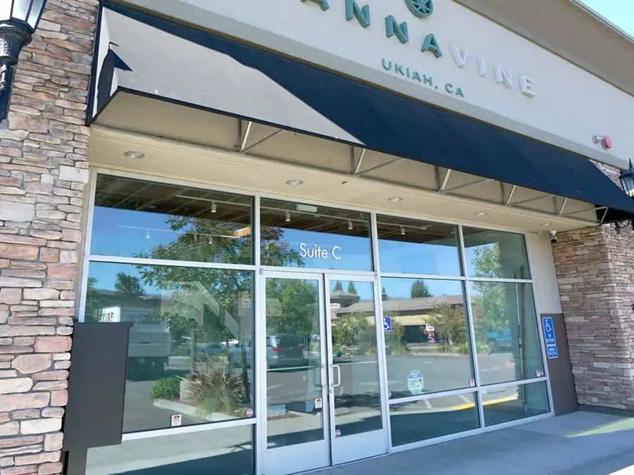 Cannavine Ukiah storefront with sign, awning, and glass windows on sunny day