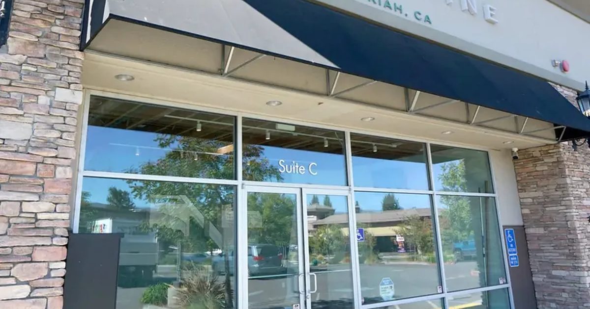 Exterior of Cannavine Ukiah storefront with glass doors and stone pillars